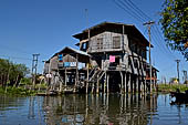 Inle Lake Myanmar. All the buildings are constructed on piles. Residents travel around by canoe, but there are also bamboo walkways and bridges over the canals, monasteries and stupas. 